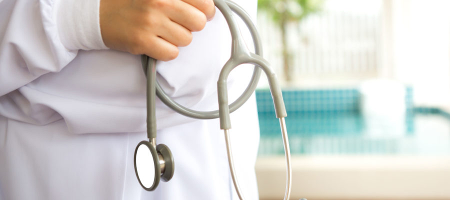 Doctor with stethoscope in the hands